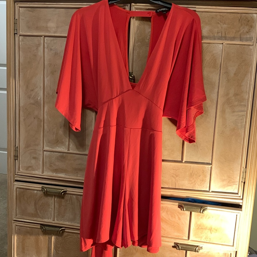 Beautiful orange jumper. Can be dressy or casual. Smoke & pet free home.